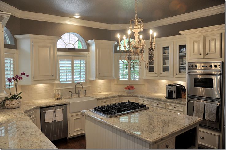Beautiful Kitchen remodel using 'Bianco Romano' granite and simple cream-colored subway tile.  Fresh and modern!