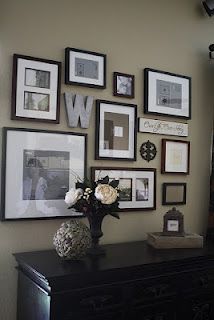 Gallery Wall! LOVE! This website also has great design templates!  Start with hanging up paper on the all that is the same size as your picture frames.  This way you can experiment with different layouts and see what you like best.
